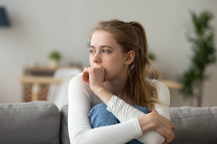 Girl biting hand showing anxiety